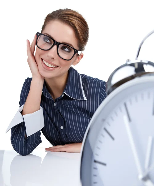 Bored woman at her desk at the end of the day Stock Image
