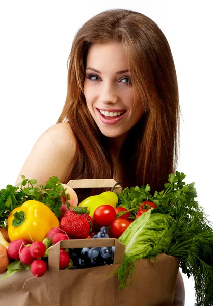 Mujer sosteniendo una bolsa llena de comida saludable. compras  . — Foto de Stock