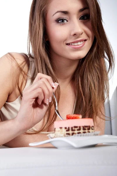 Young happy woman with cake at home — Stock Photo, Image