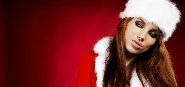 Portret van mooi sexy meisje het dragen van kerstman kleding — Stockfoto