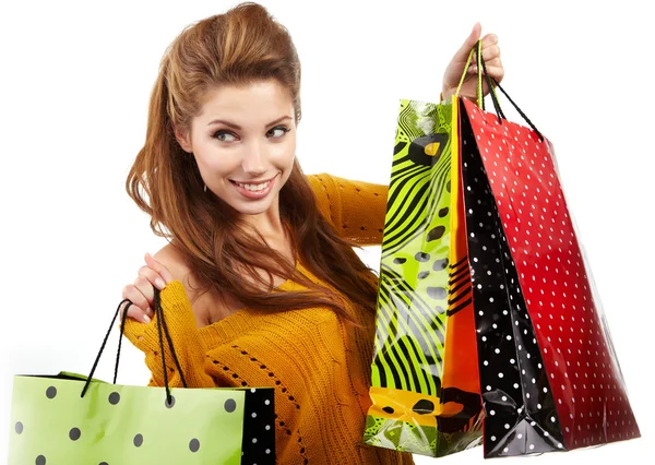 Foto de jovem mulher sexy com sacos de compras — Fotografia de Stock