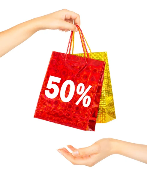 Woman's hands with shopping bags — Stock Photo, Image