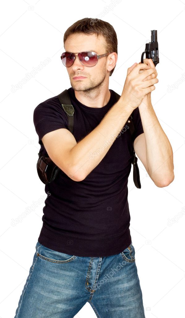 Man with a gun in the holster