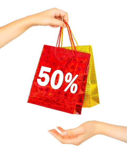 Mãos de mulher com sacos de compras — Fotografia de Stock