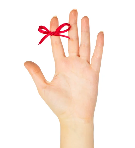 Red bow on finger — Stock Photo, Image