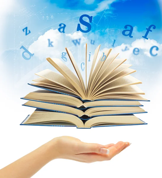 The Magic Book and the letters over hand — Stock Photo, Image