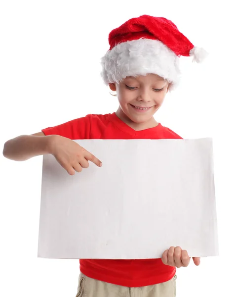 Niño en un sombrero de Navidad y la forma en las manos — Foto de Stock