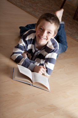 Boy reeding book clipart