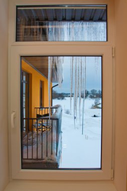 Icicles on roof in cols winter clipart