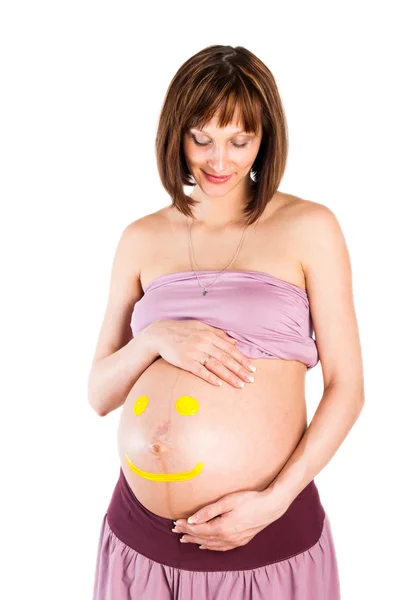Retrato de la mujer embarazada sobre un fondo blanco —  Fotos de Stock