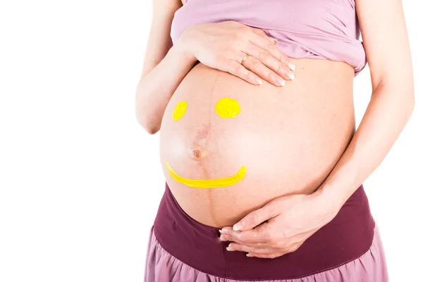 Kobieta w ciąży brzuch z uśmiechem — Zdjęcie stockowe