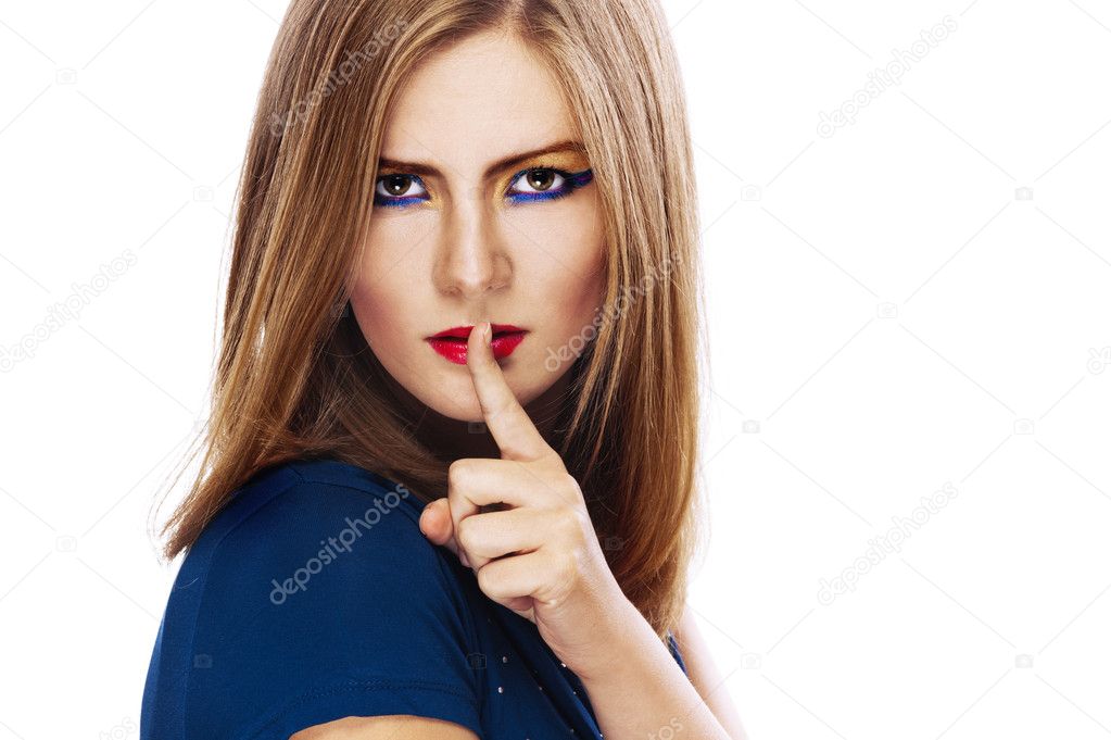 Beautiful woman finger near lips