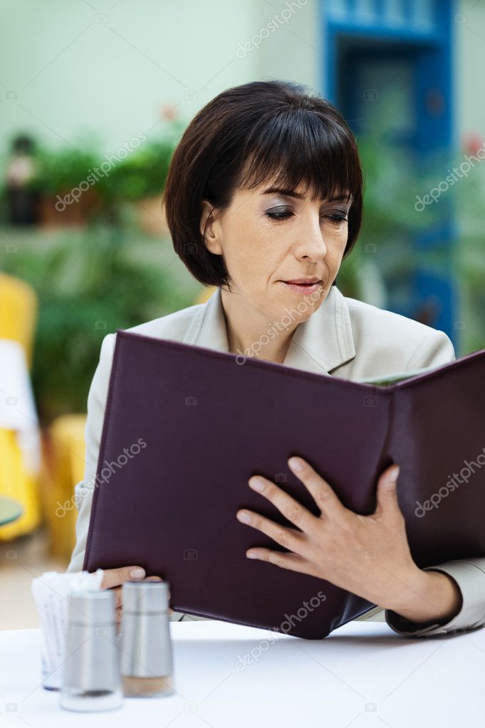 Woman cafe reading menu