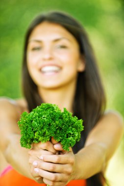 Portrait cheerful woman hands herbs clipart