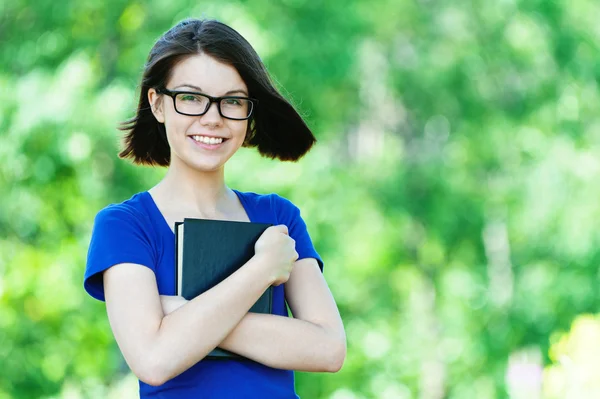 Retrato bonito estudante óculos livro — Fotografia de Stock