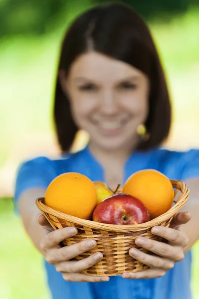 Beautiful girl basket fruit — Stock Photo, Image
