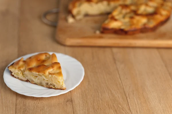 stock image Whole tart cut piece delicious white plate