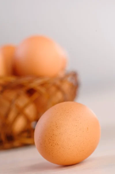 Closeup brown eggs wicker basket — Stock Photo, Image