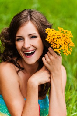 Portrait young gay beautiful woman holding bouquet yellow wildfl clipart