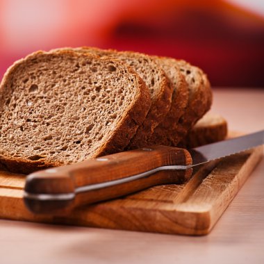 Rye bread on kitchen table clipart
