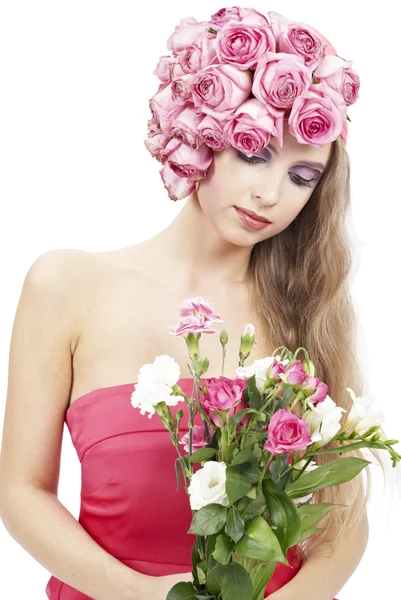 Giovane bella donna con fiori rosa — Foto Stock