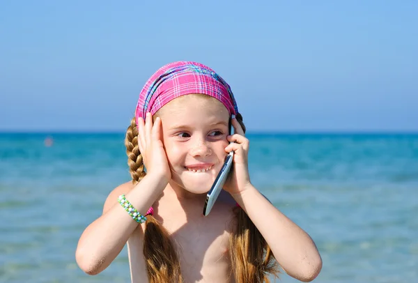 A little girl with cellular phone — Stock Photo, Image