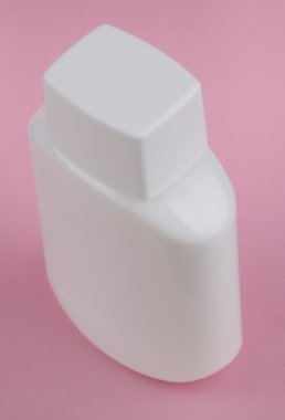 Perfumery bottle on pink background