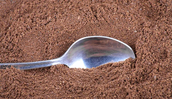 Milled coffee and teaspoon — Stock Photo, Image