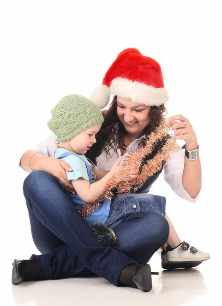 Girl in a santa hat with a little boy — Stock Photo, Image