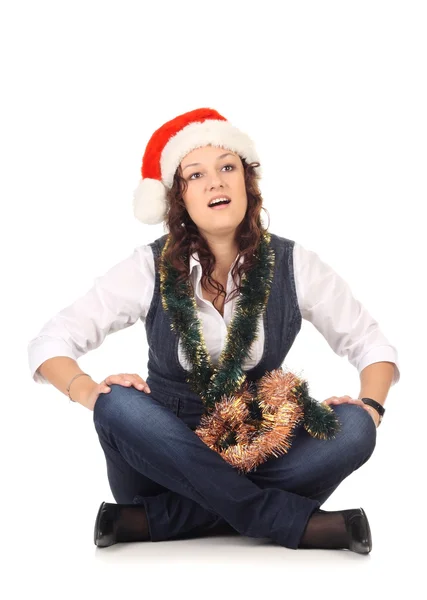 Girl in a santa hat with christmas decoration — Stock Photo, Image
