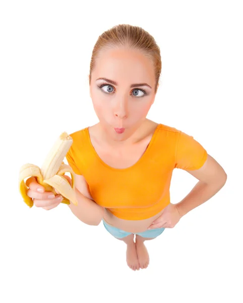 Забавная молодая женщина с бананом — стоковое фото