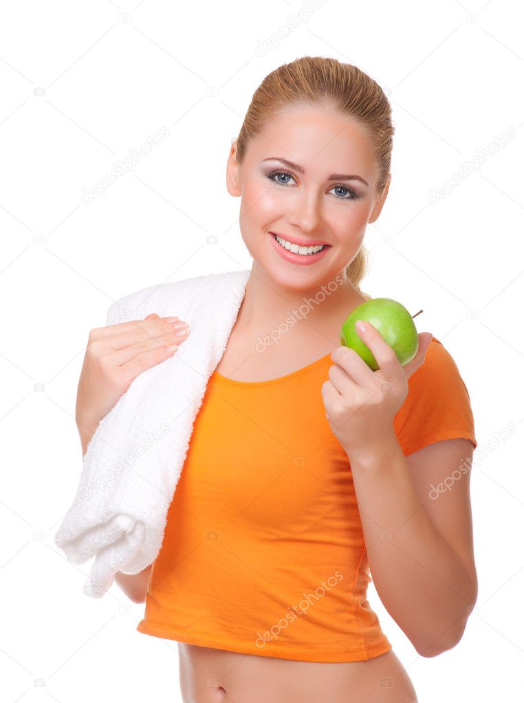 Young woman with towel and apple