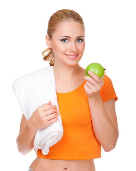 Mladá usměvavá žena s ručníkem a apple — Stock fotografie