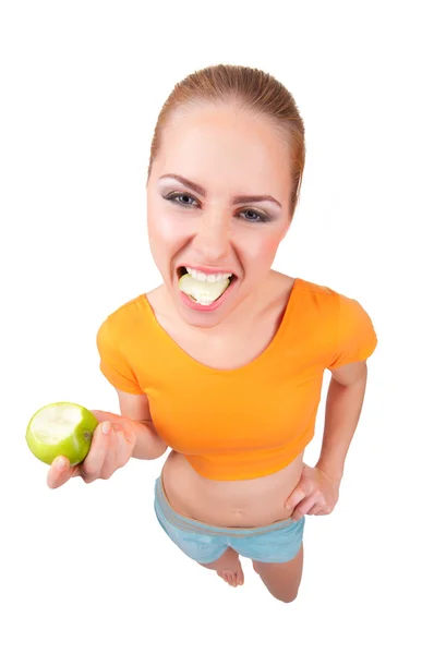 Młoda kobieta śmieszne z zielonym jabłkiem — Zdjęcie stockowe