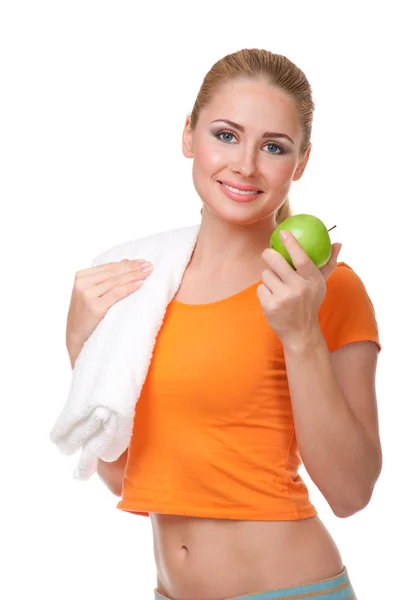 Молодая улыбающаяся девушка с яблоком — стоковое фото