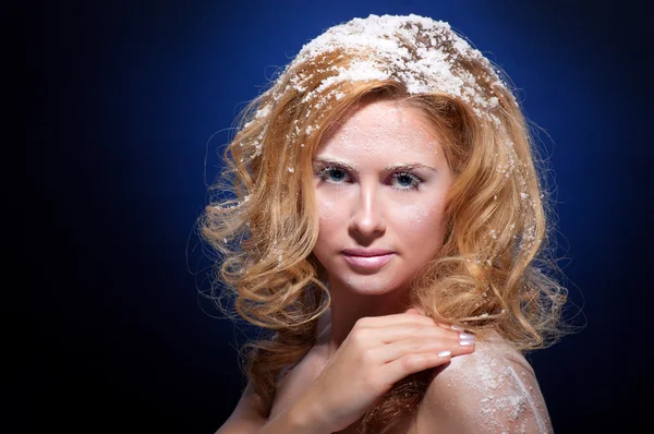 Young beautiful woman with snowy skin — Stock Photo, Image