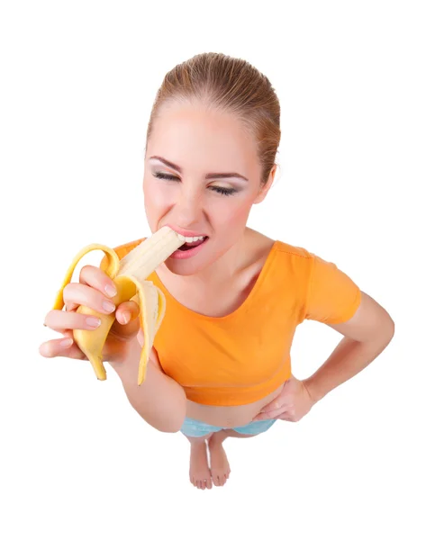 面白いの若い女性はバナナを食べる — ストック写真