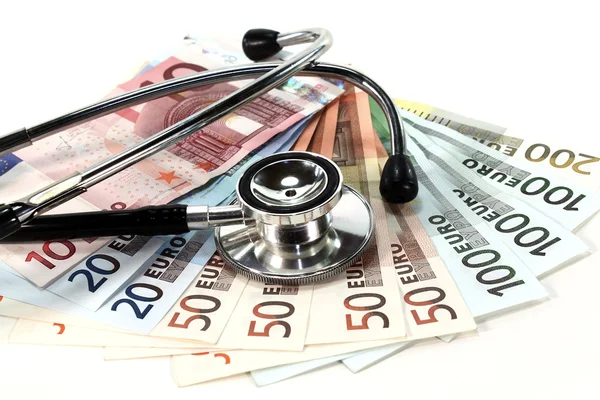 Stetoscopio e denaro — Foto Stock