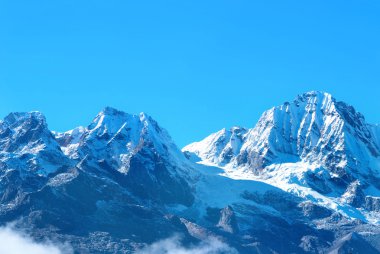 High mountains, covered by snow. clipart