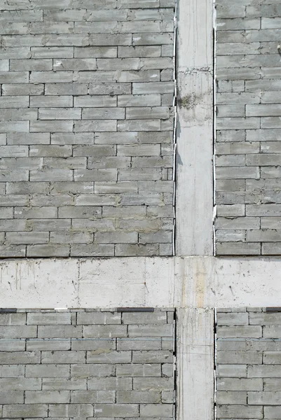 Stěna texturované šedé stavební cihly. — Stock fotografie