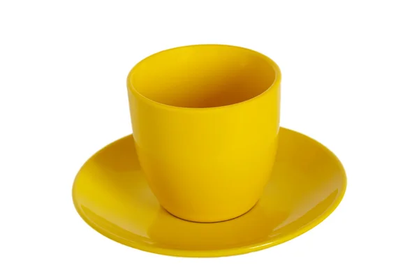 Sarı çay bardağı ve tabağı beyaz zemin üzerine. — Stok fotoğraf