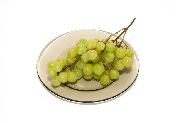Green grapes on the plate isolated on white. — Stock Photo, Image