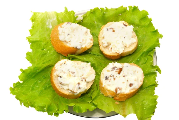Τέσσερα σάντουιτς με πράσινο μαρούλι απομονωθεί σε λευκό. — Φωτογραφία Αρχείου
