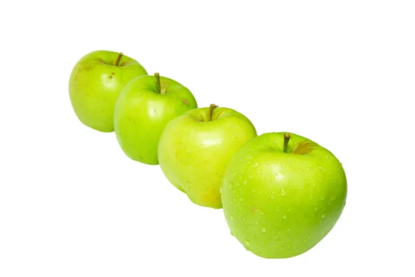 Řada zelených jablek, izolované na bílém. — Stock fotografie