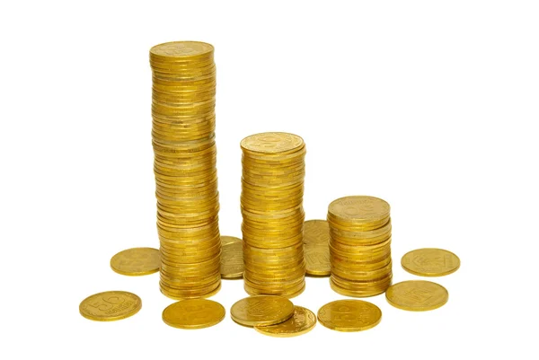 Pilhas de moedas de ouro isoladas em branco . — Fotografia de Stock