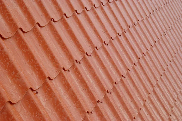 Mur de tuiles rouges texturées . — Photo