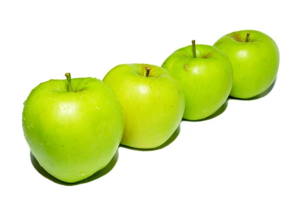 Row of green apples isolated on white. — Stock Photo, Image