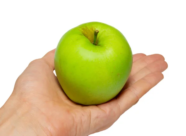 Zelené chutná jablko v ruce izolované na bílém. — Stock fotografie