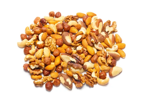 Haldy mnoho druhů lískových ořechů izolovaných na bílém. Stock Obrázky