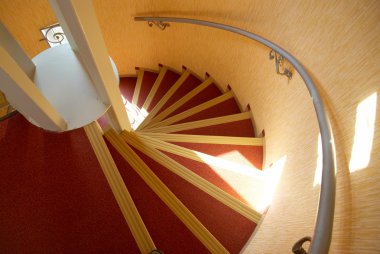 Spiral staircase in a house. clipart